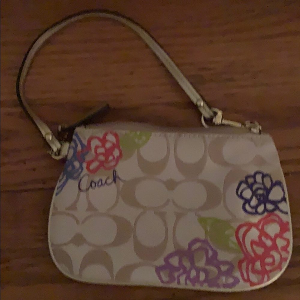 Coach wristlet. Tan with spring flower pattern